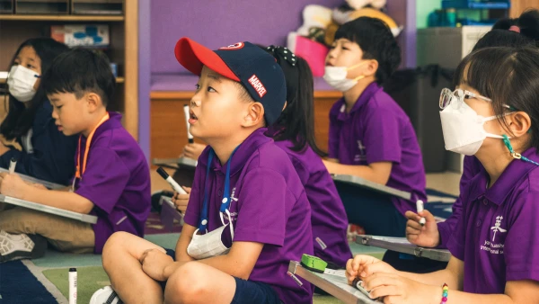 young students at yantai huasheng international school about to listen to their teacher