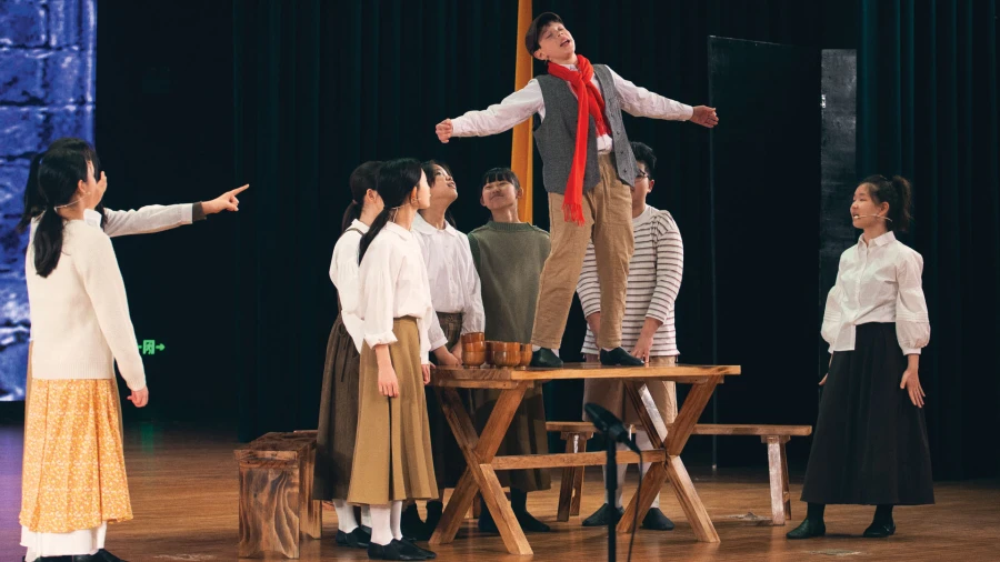 male and female student theater performance at yantai huasheng international school