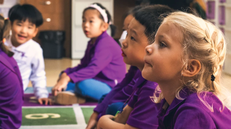 young students listening to the yantai huasheng international school safety policy presentation