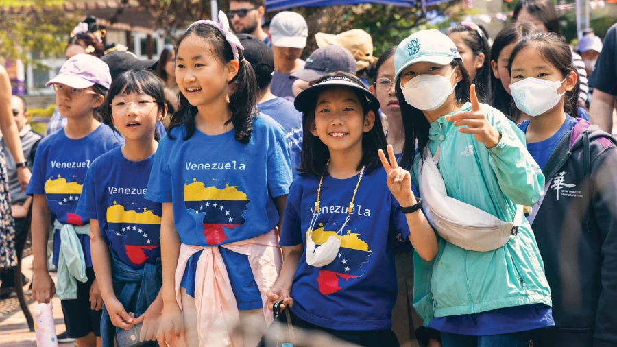 female students with venezuela tshirts at yantai huasheng international school learning on international day